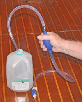 Distilled water is pumped out of the bottle through to all th batteries in one go.