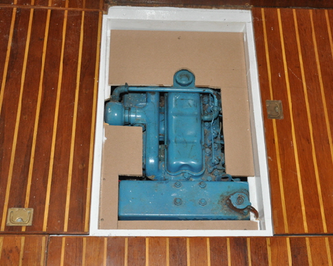 The engine is enclosed with a board, then the floorboard.