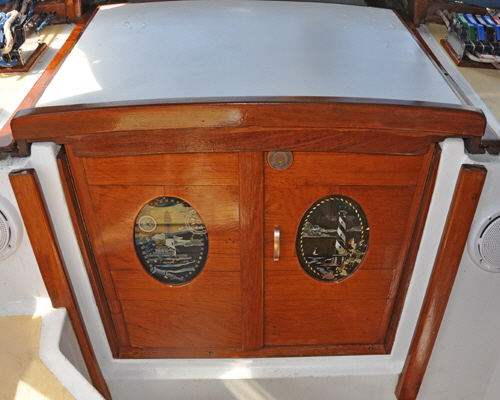 Opening doors were made from the solid teak washboards that were very difficult to handle.