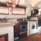 The galley was transformed, inlcluding a wawher/dryer.