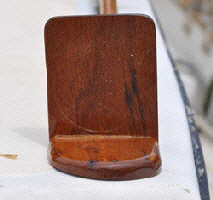 Teak bases were made to protect the new lights and keep them level on the sloping upper deck.