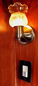 Ornamental sconces add a touch of elegance to the room.