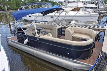 Ppontoon boats moored on a pontoon.