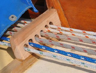 Fairleads route the lines into the cockpit.