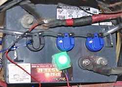 The water level indicator that blinks green when the levels are correct and changes to red when they need filling.