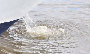 Water gushing from the exhaust.
