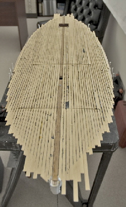 Planking being layed and caulked.