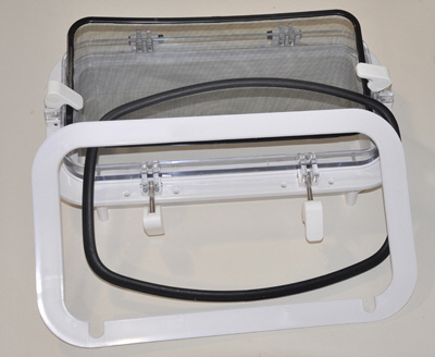 The new portlight with the new bug screen and gasket.