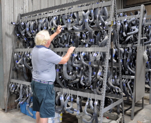Selecting new water pipes from a auto-storeroom.